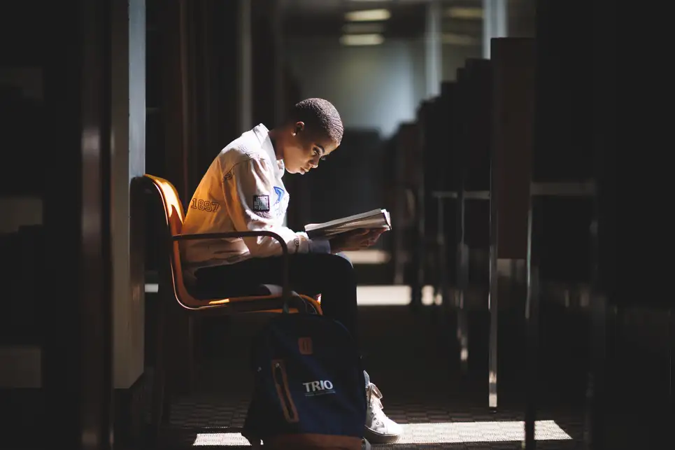 Voorhees University student reading in library